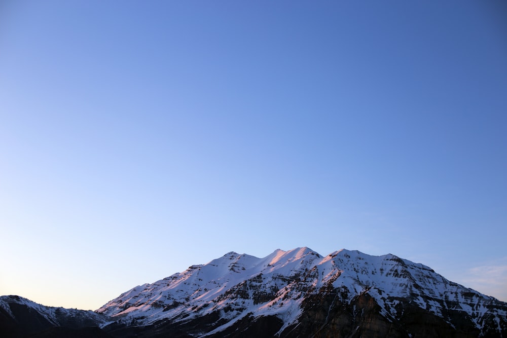 snow covered mountain during daytime