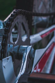 Detailed shot of a motorcycle transmission system with gears and chain.