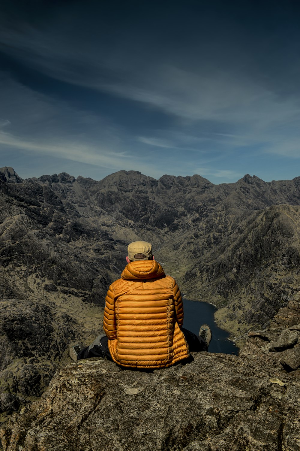 man wearing orange bubble jacket