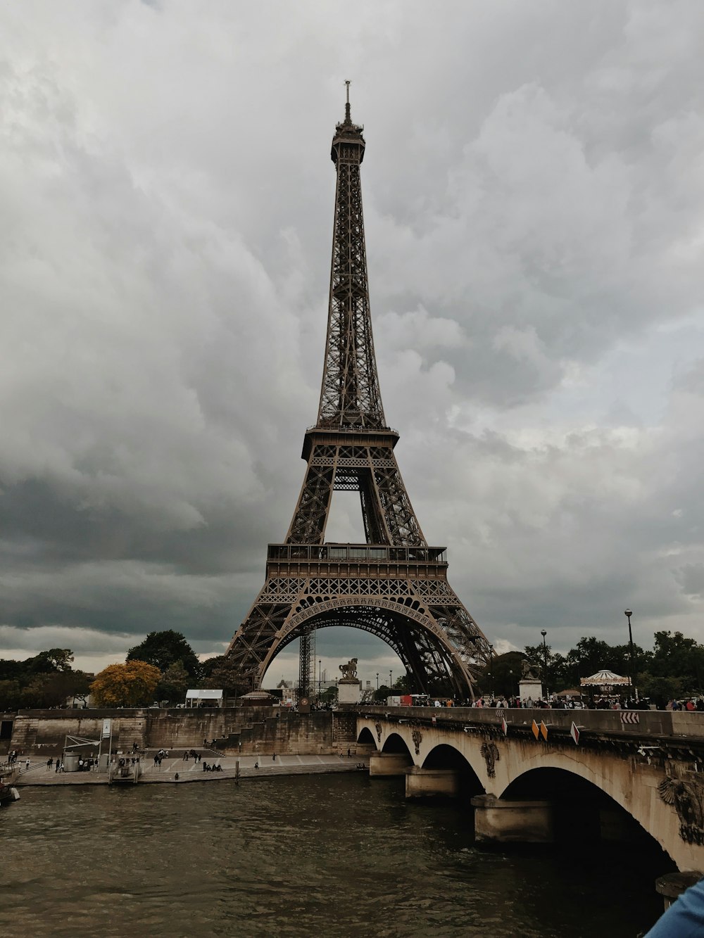 Eiffel tower under white clouds