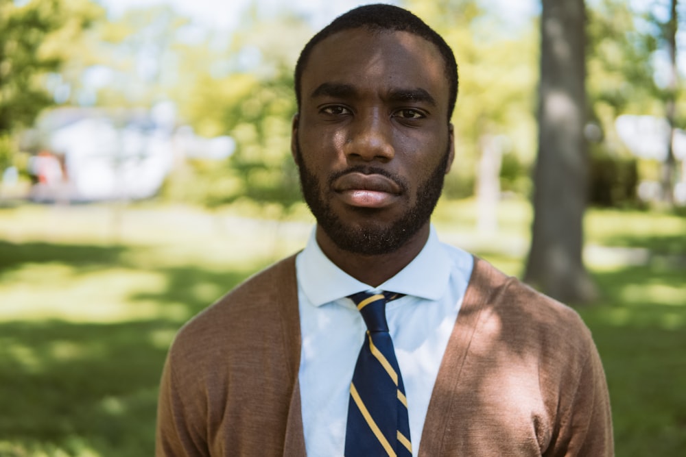 man wearing brown cardigan