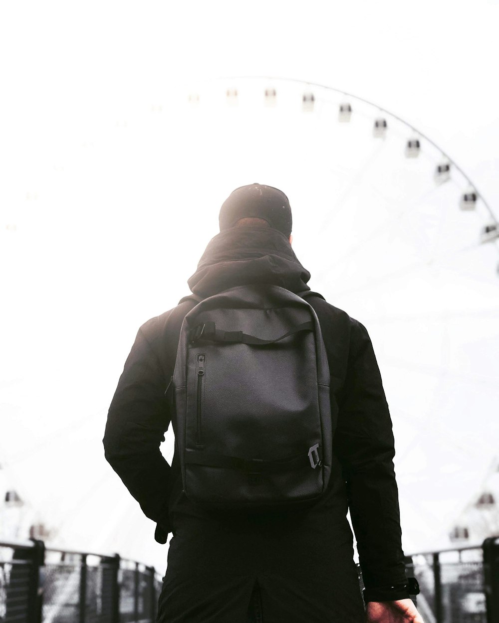 man carrying backpack