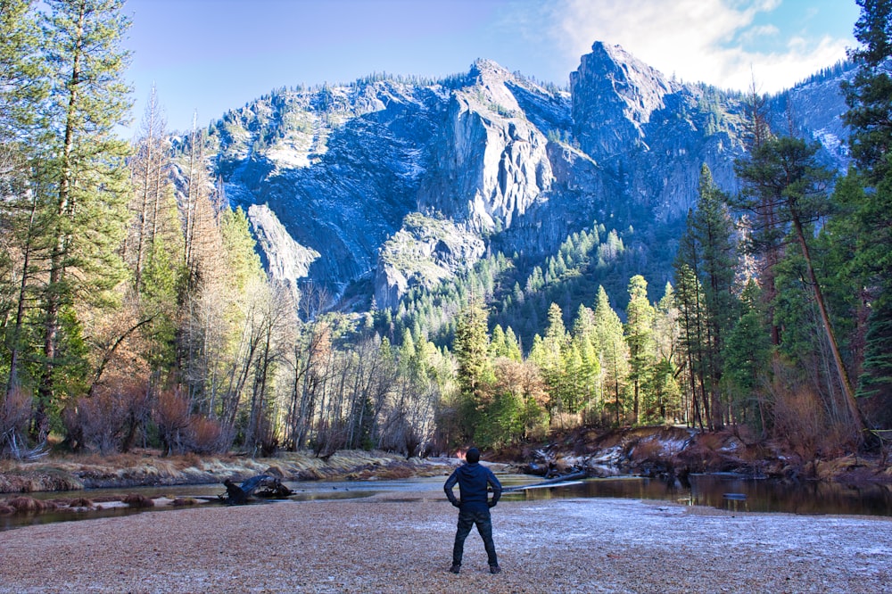 man standing near mountains during daytime