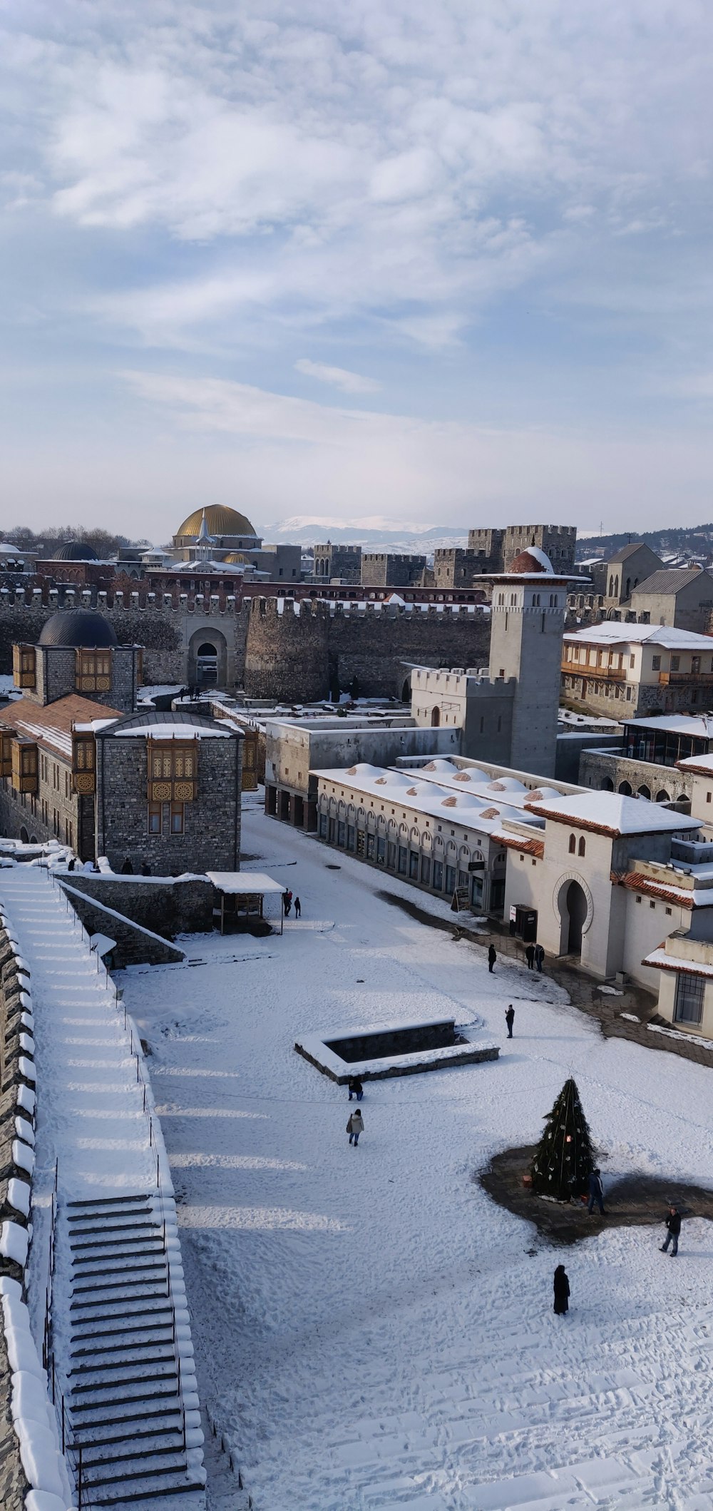 gray concrete buildings filled with snow