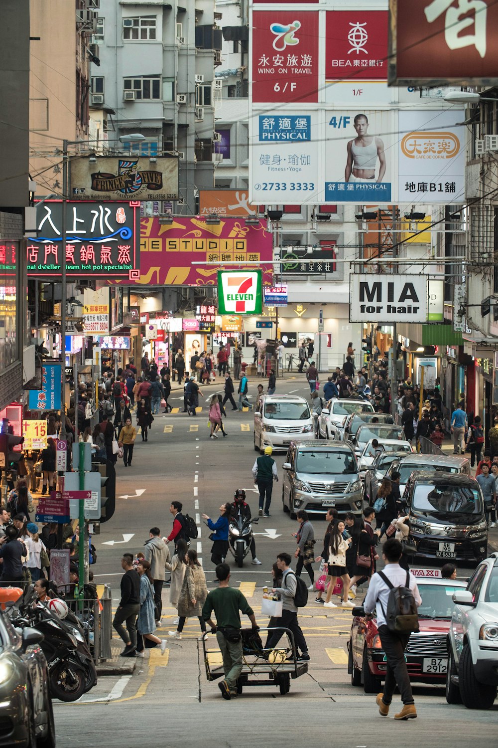 crowd of people walking around city urban road