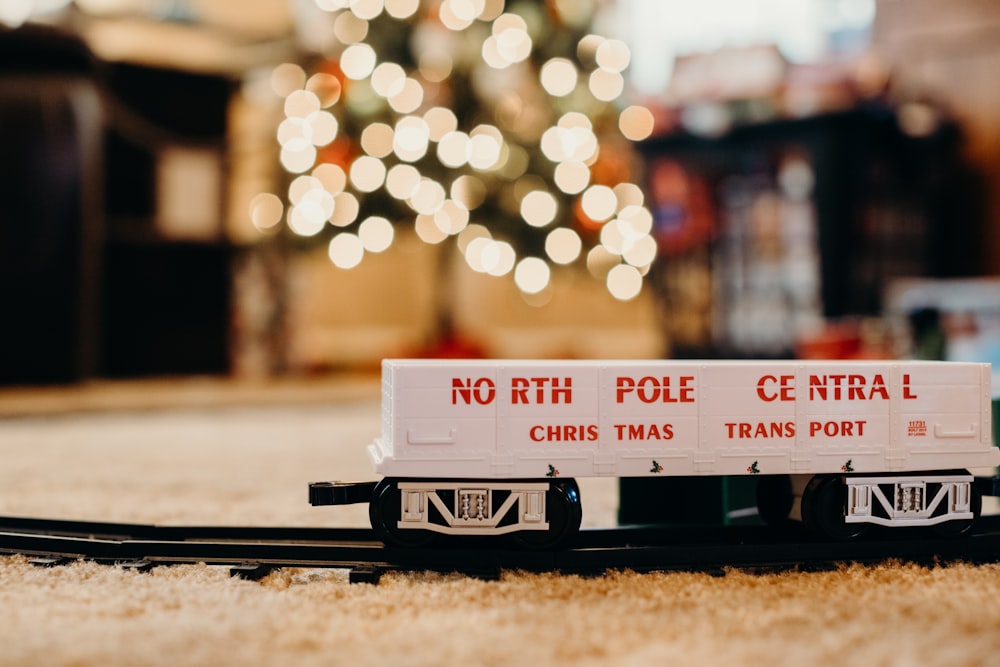 white and black toy train on track selective focus photography