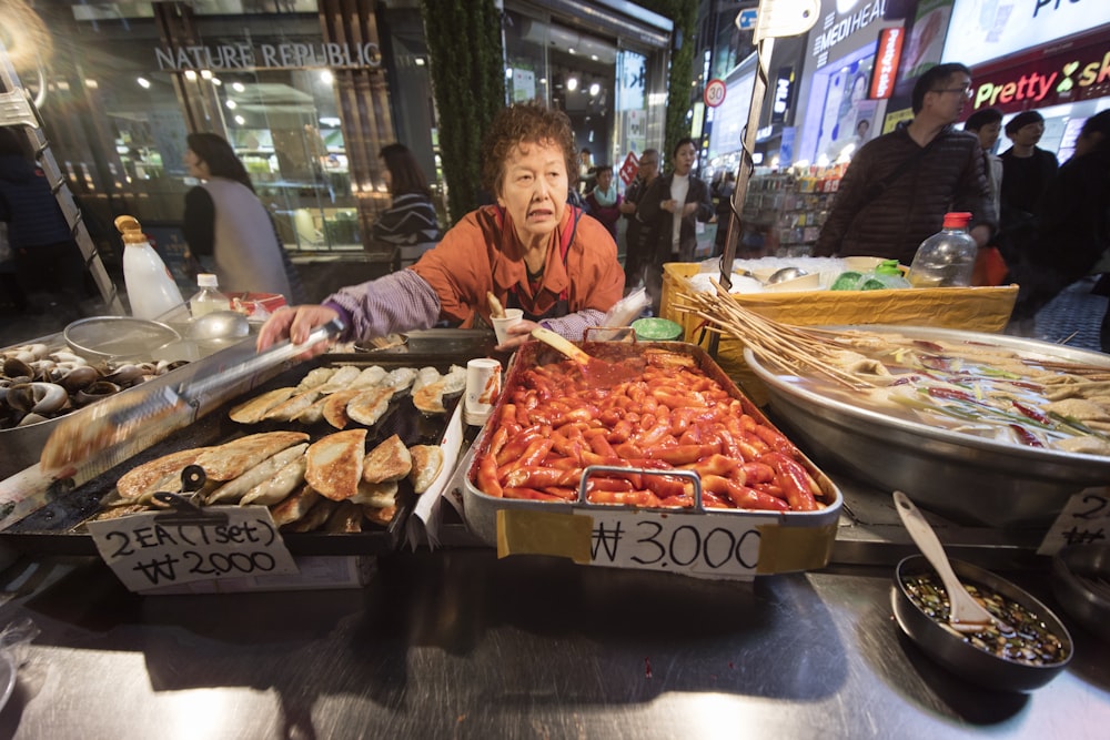 dishes on tray in front of woman