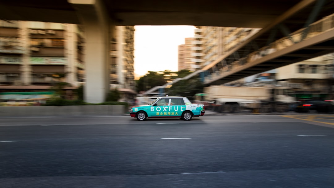 teal and white taxi