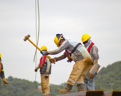 construction worker men holding hammer