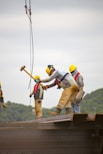 construction worker men holding hammer