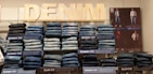 An array of jeans in different styles and fits laid out artistically.