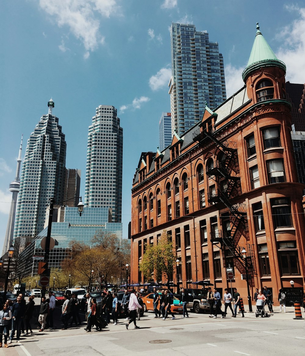 high-rise buildings with people walking on the street during daytime