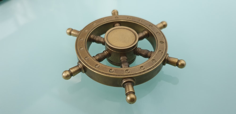 brown metal ship wheel scale model