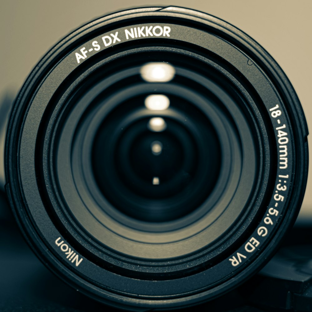 black Nikon camera lens