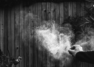 greyscale photography of powder