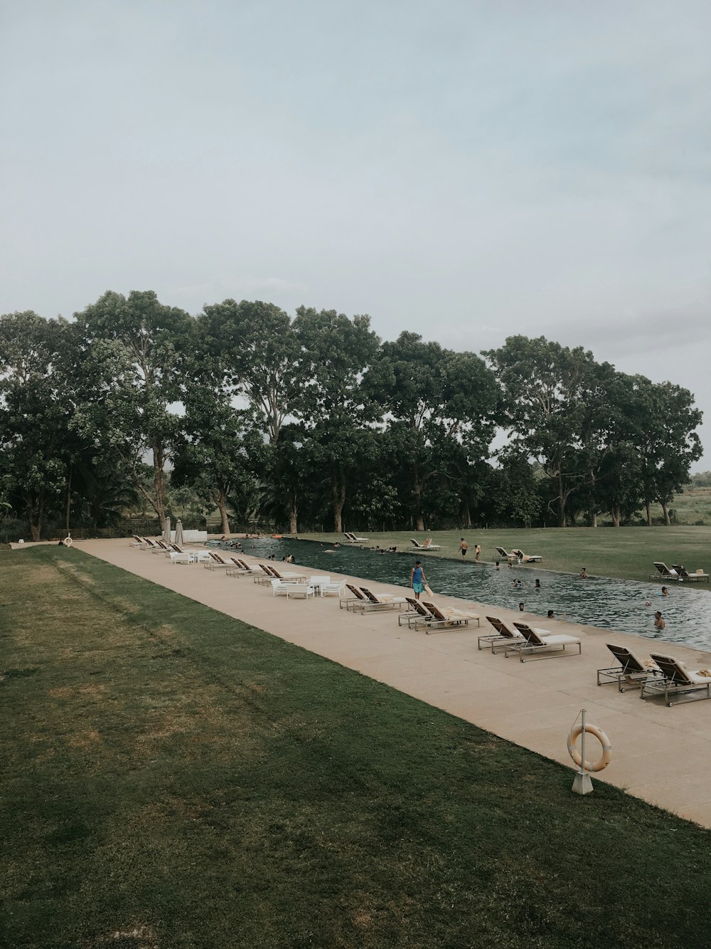 sunloungers near water pool