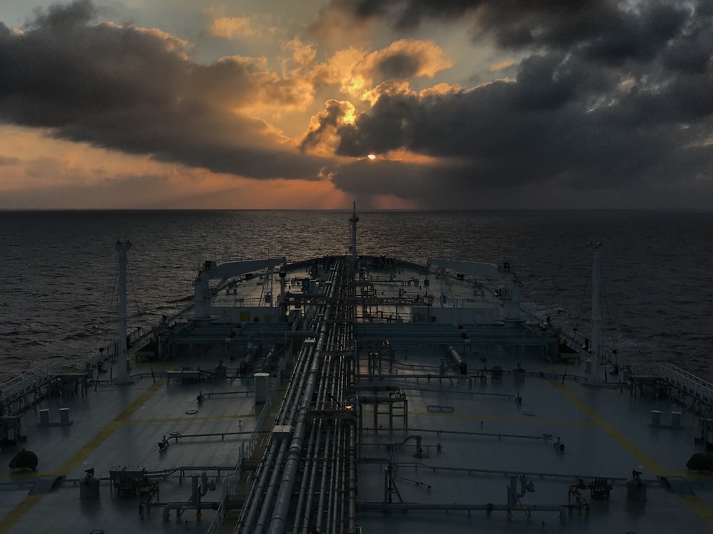 grey and brown ship during golden hour