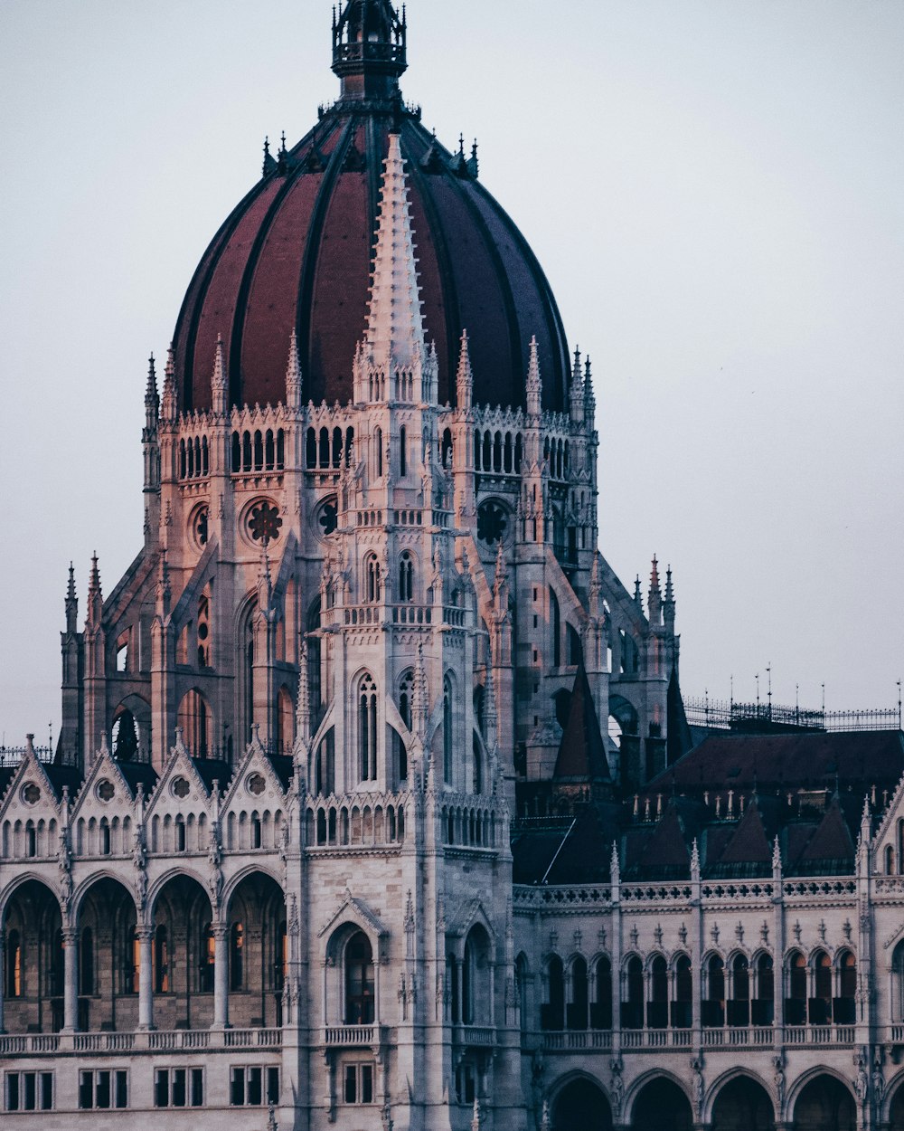 maroon and white cathedral under white skies