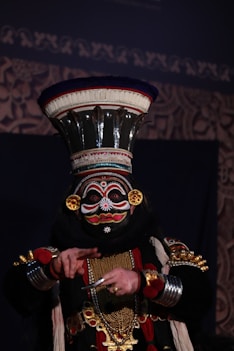 An artist playing traditional Kathakali dance of kerala