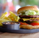 hamburger and fries with dip on tray