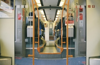 Interior view of a railway carriage showing sturdy aluminum seat frames.