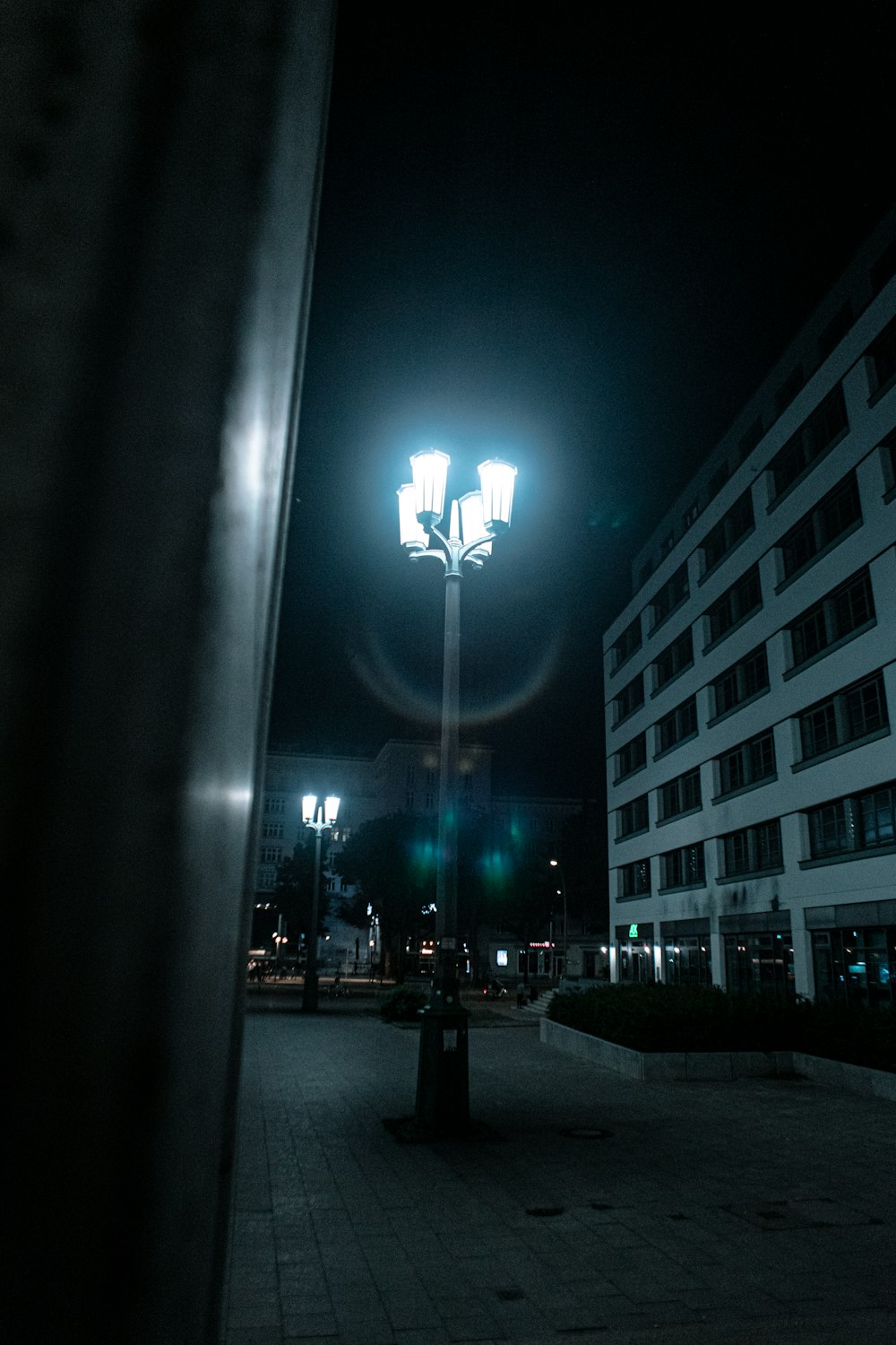 lighted street lights near building