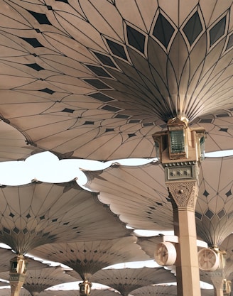 people under pillars with roofs