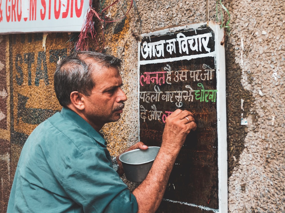 man painting the wall