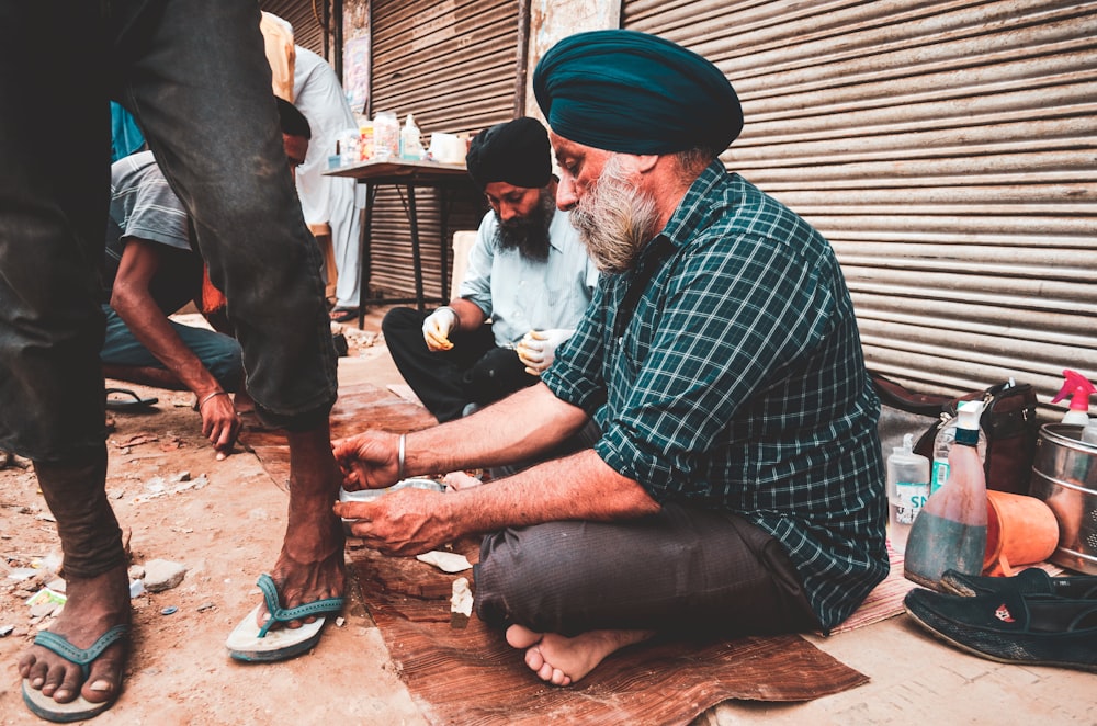 man touching person's ankle