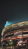 Stadium illuminated at night with the club’s emblem visible.