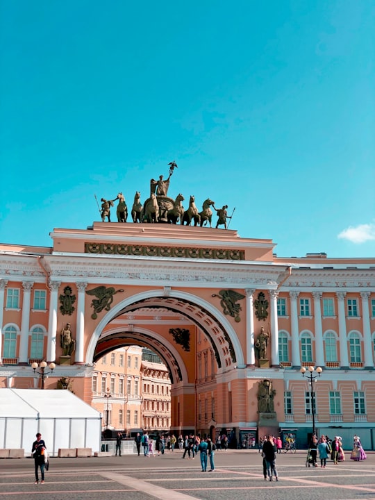 people walking on plaza in Winter Palace Russia