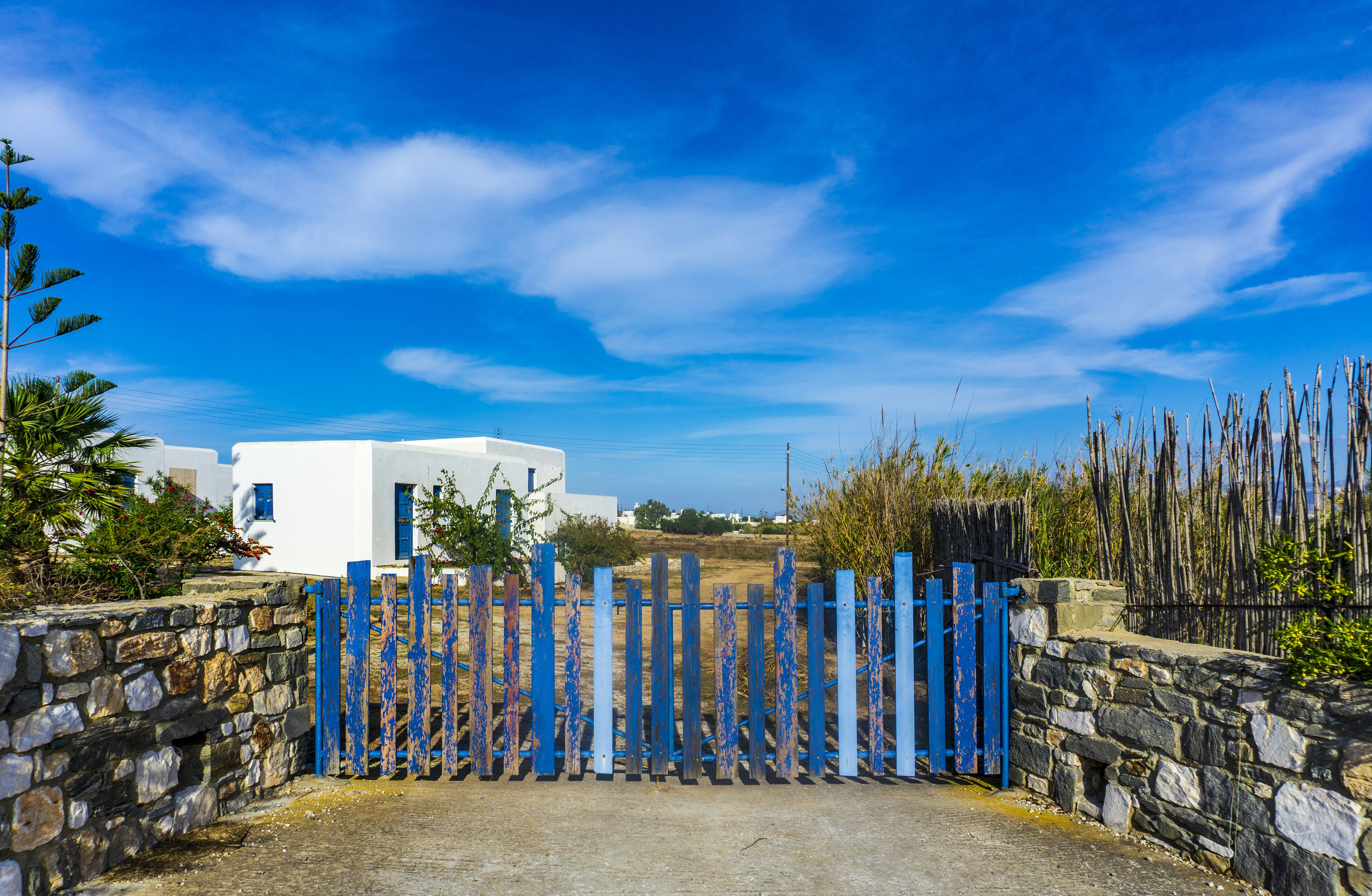 blue wooden gate under blue sky
