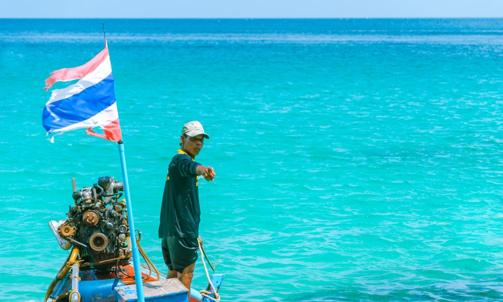 man riding boat photography