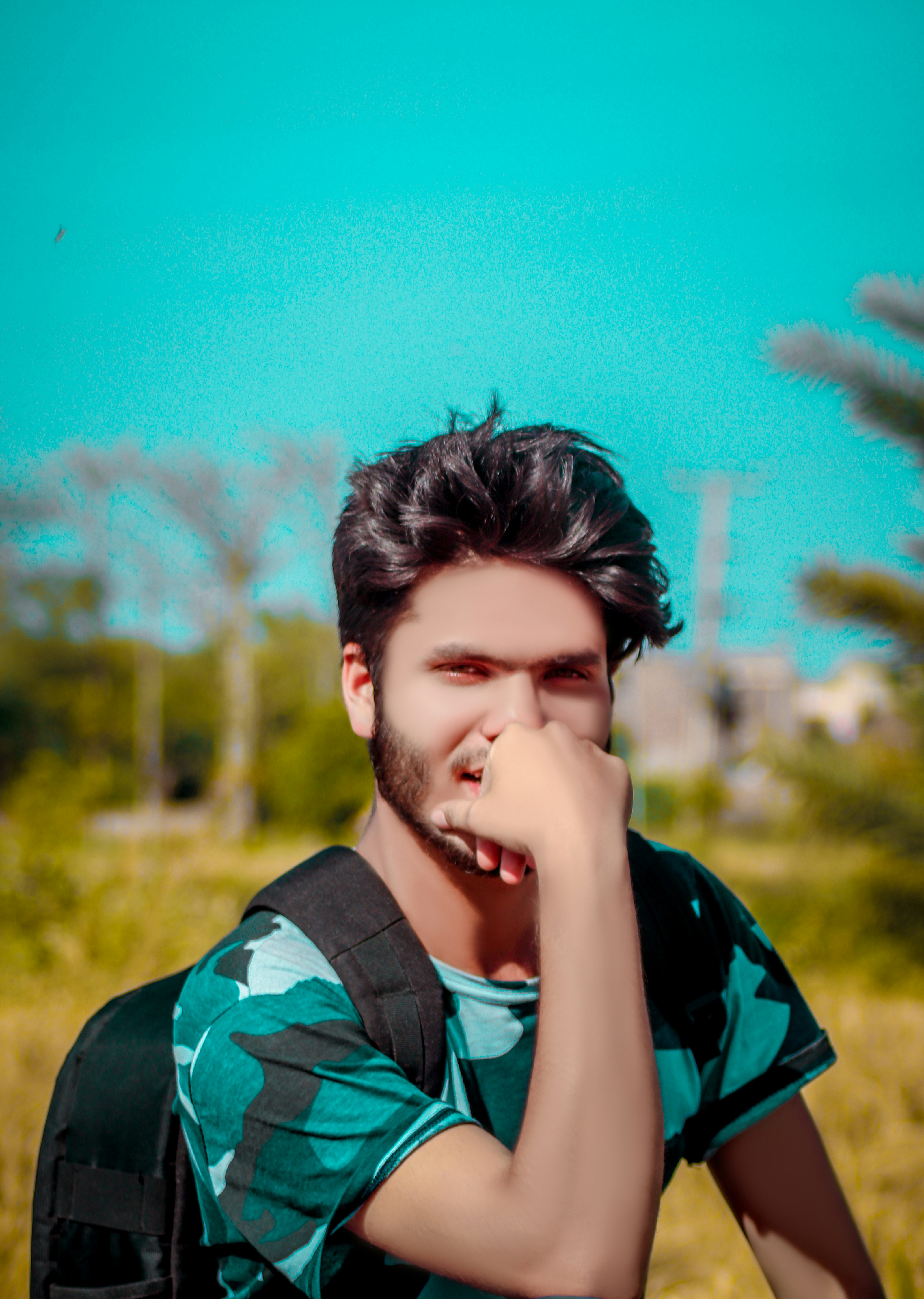 Man Wearing Green And Black Camouflage Crew Neck T Shirt Photo