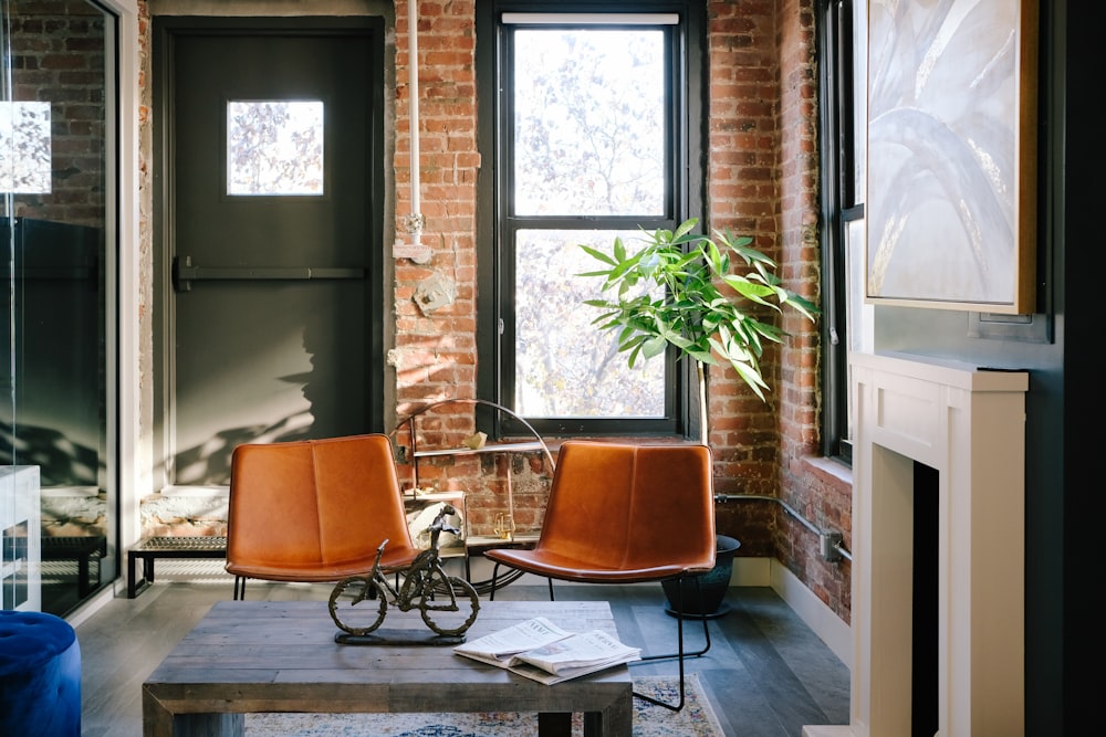 two vacant orange chairs in room