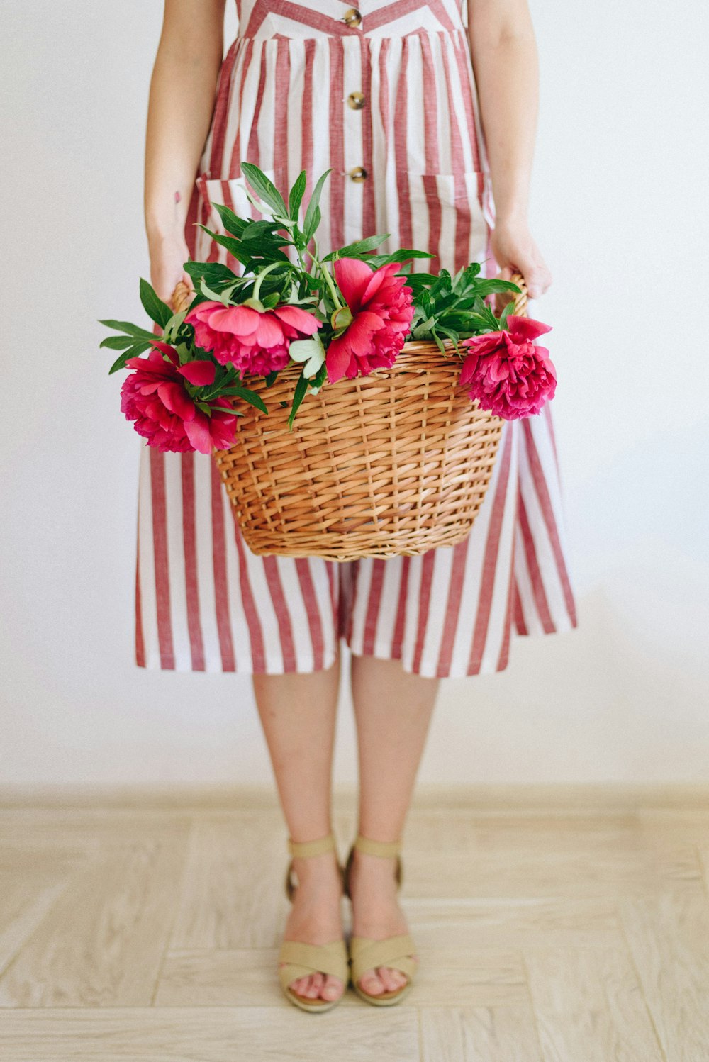 woman holding flower basket