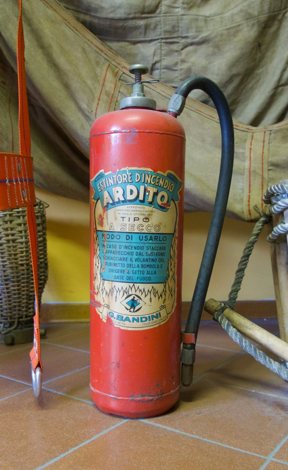 vintage red Ardito fire extinguisher