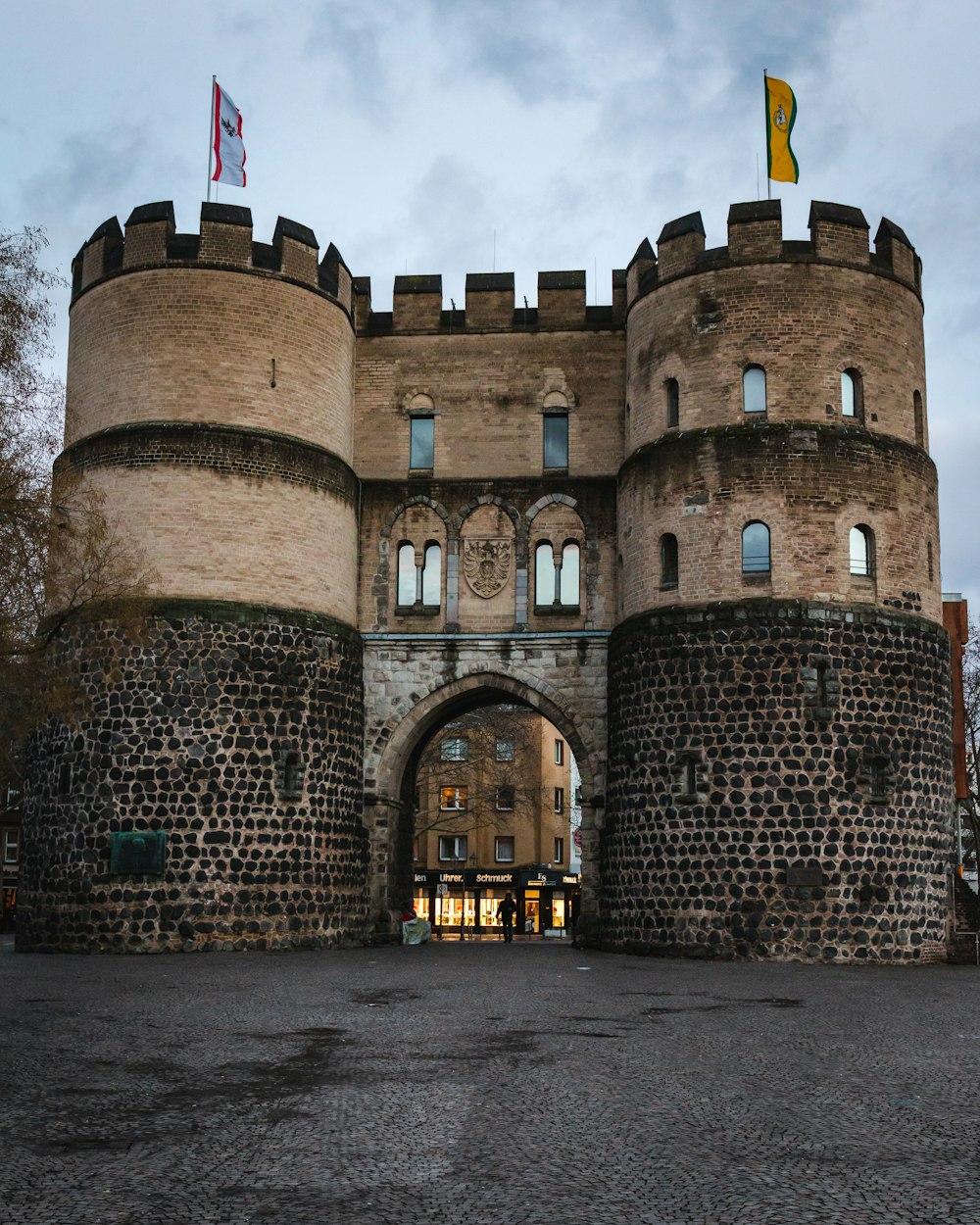 brown fort with flag on top[ during daytime