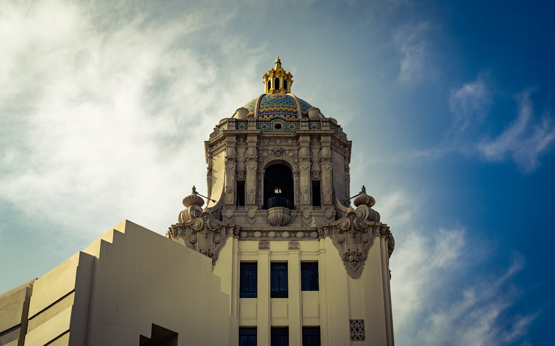 white and gray concrete building with tower during daytime