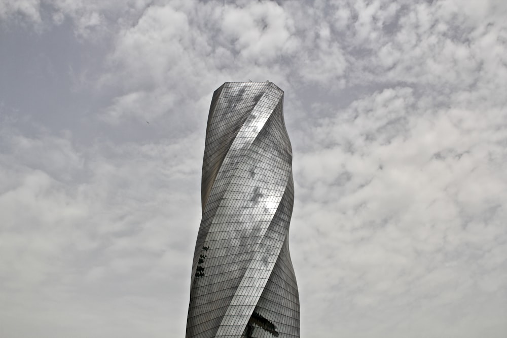 spiral gray building during daytime