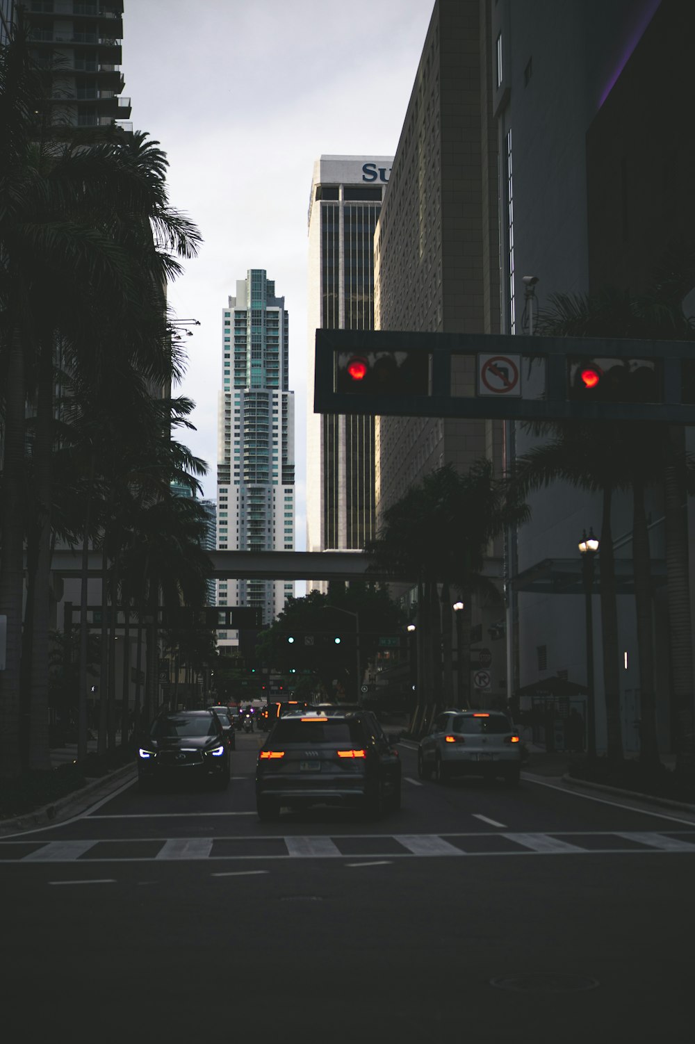 vehicle on road passing between buildings