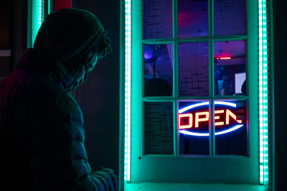 man near open sign