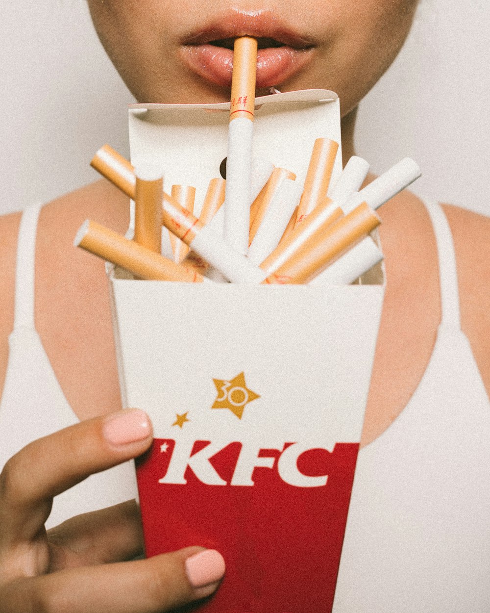 KFC bucket filled with cigarette