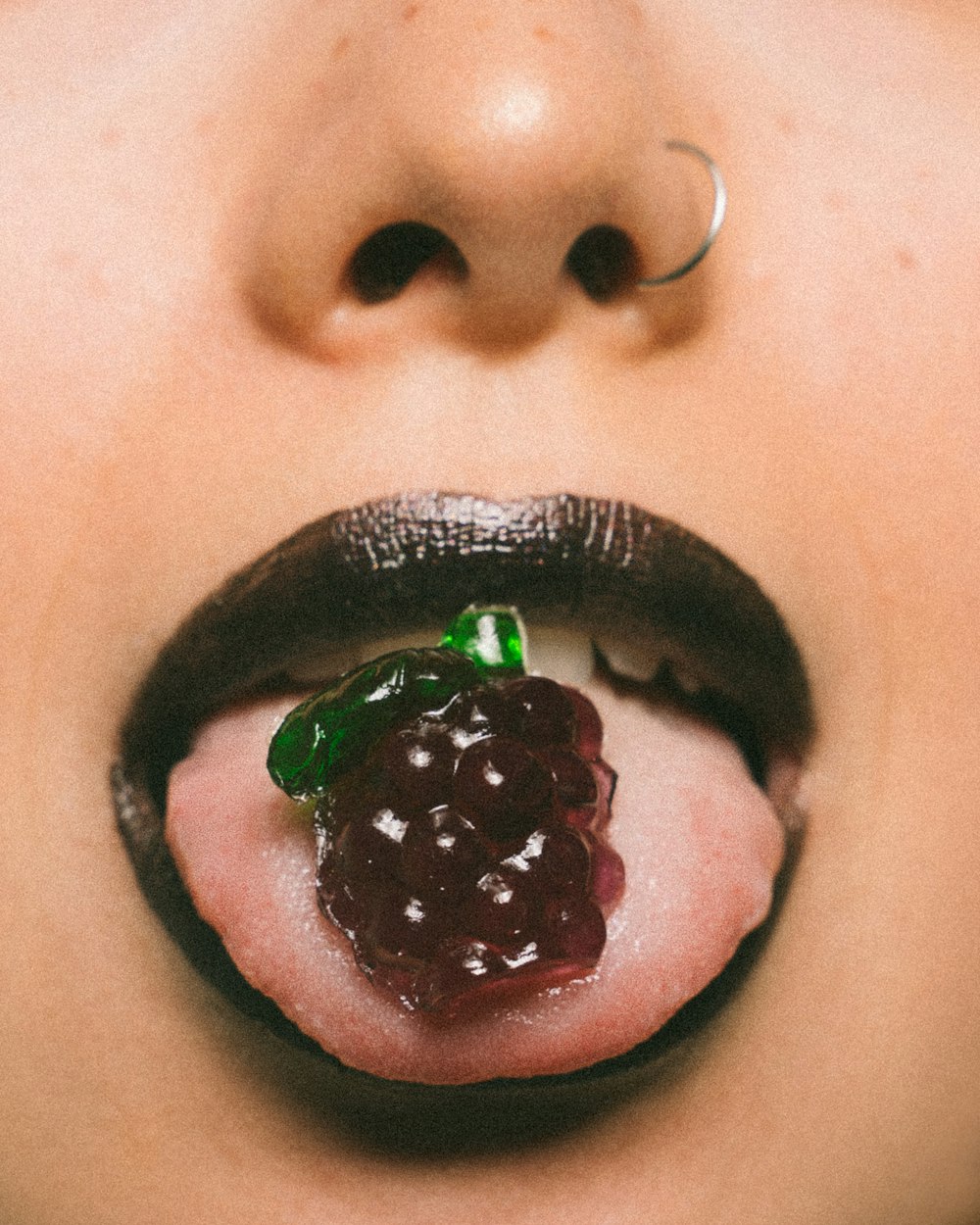 grapes candy on mouth