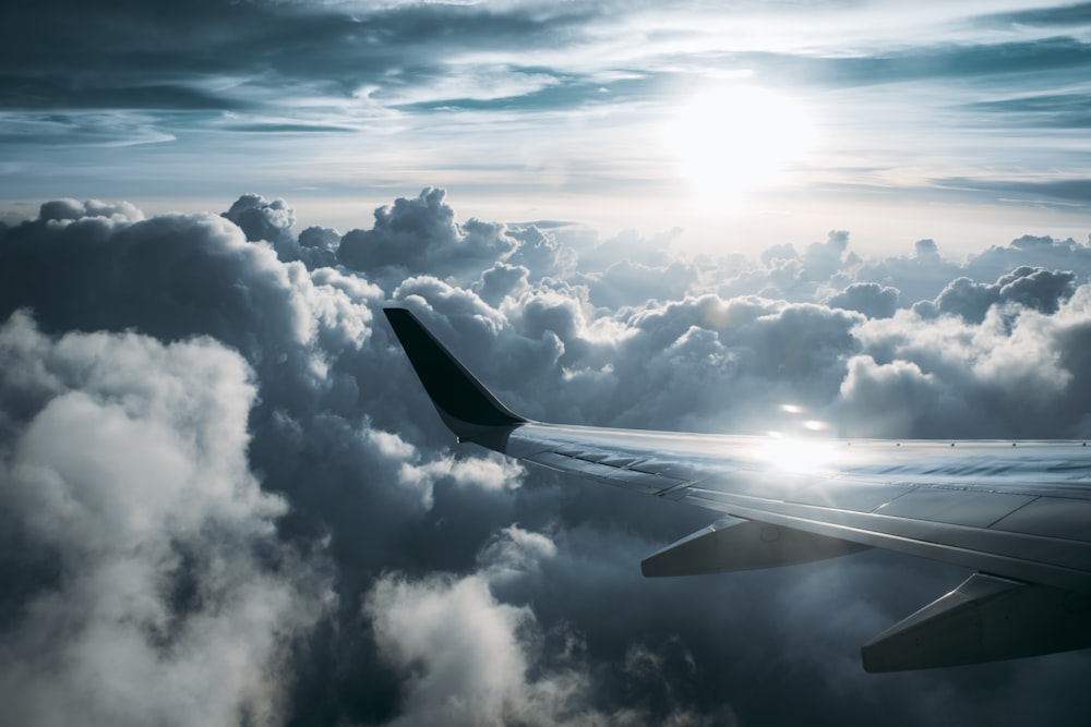 a view of the wing of an airplane in the sky