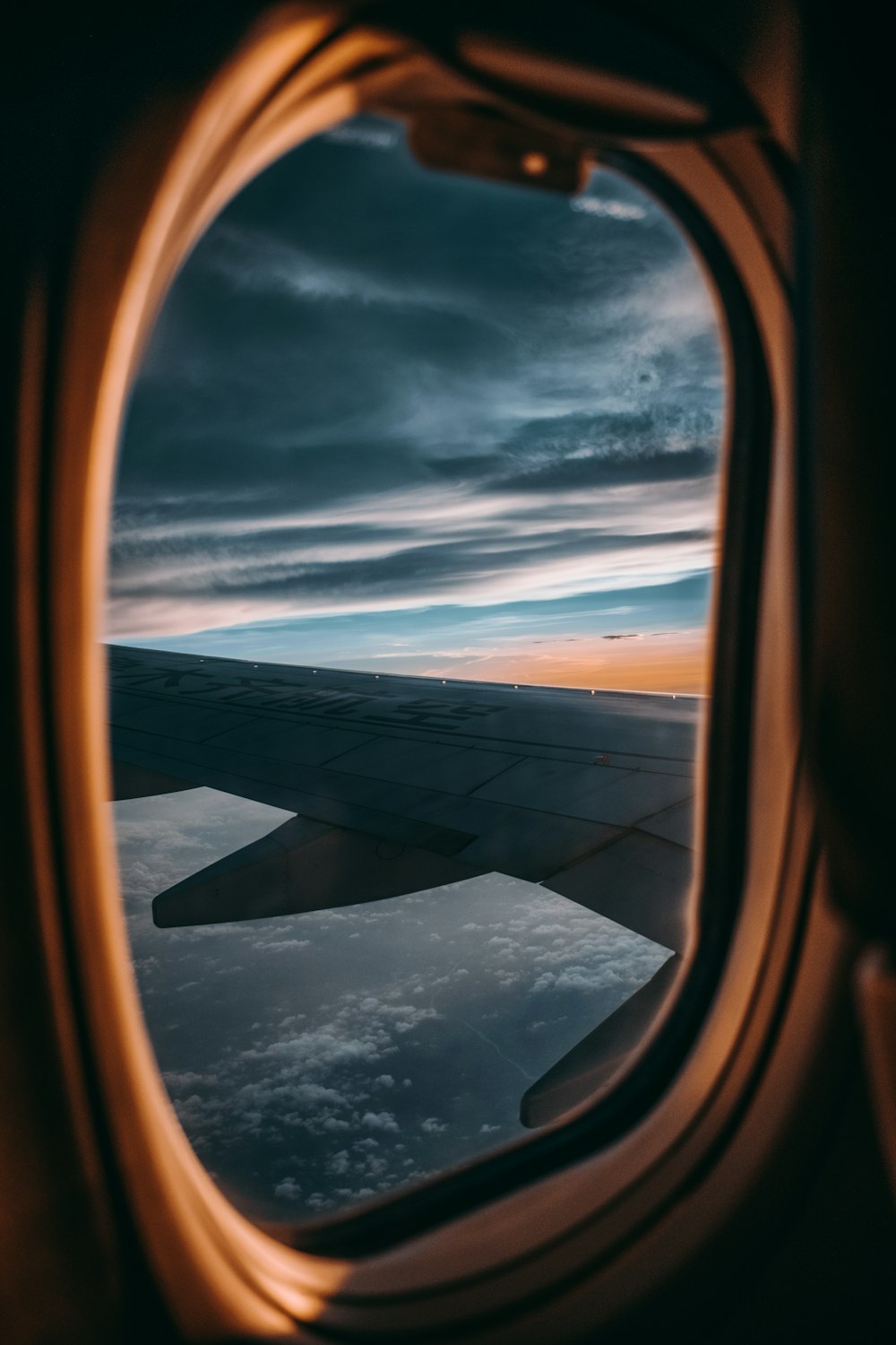 a view of the wing of an airplane from the window
