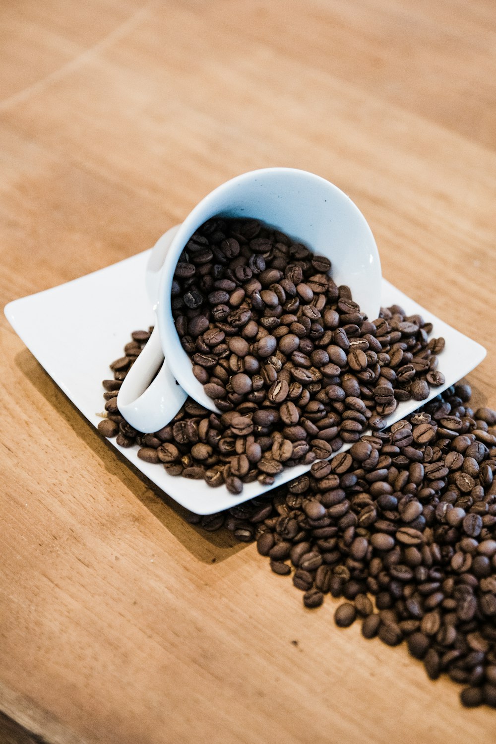 coffee beans with coffee cup and saucer