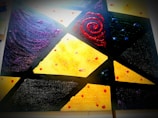 A colorful modern art piece featuring geometric patterns and textures.