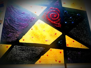 A colorful modern art piece featuring geometric patterns and textures.