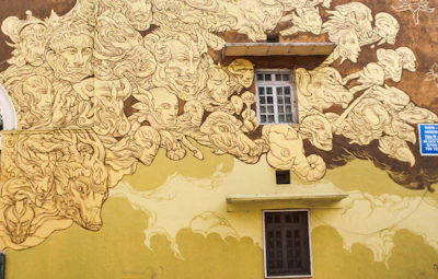 A mural featuring a harmonious blend of natural elements and celestial patterns in vivid colors.